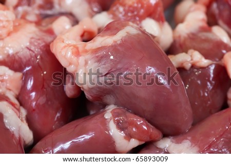 Meat offal. Closeup of  fresh raw bird hearts