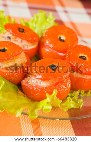 cooked baked stuffed tomato. See in series stages of cooking of stuffed tomato