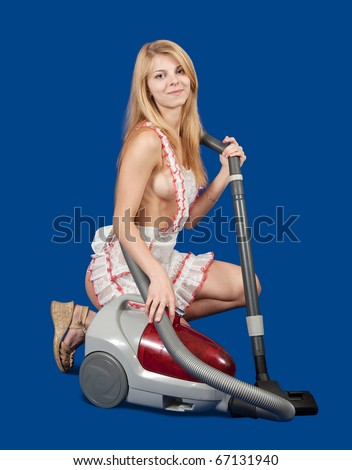 Sexy maid with vacuum cleaner over blue