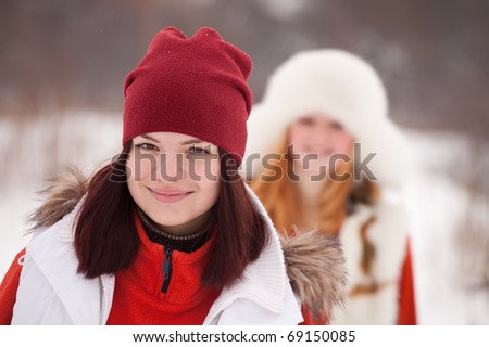 stock photo Two sporty girls workouts at winter park