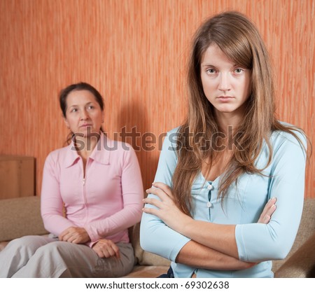 daughter and mother having quarrel at home
