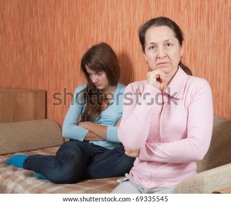 Mother and teen daughter having quarrel at home