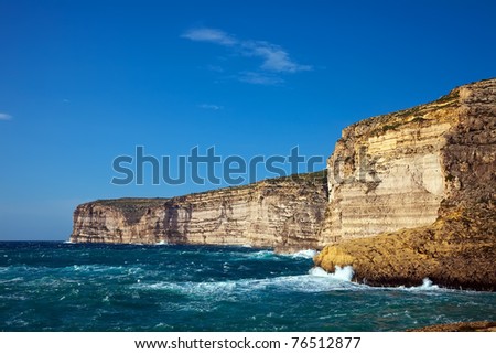 Sea wave breaking against coast  cliff. Mediterranean area, Maltese islands