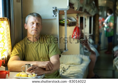 Mature  man riding a sleeper train