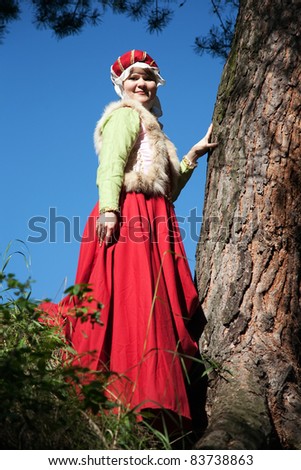 girl in european historical clothing  of XIII century at nature