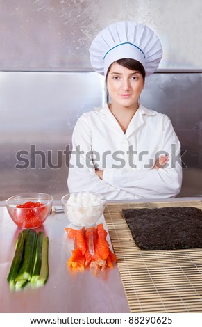 Cook woman with ingredients for making sushi rolls