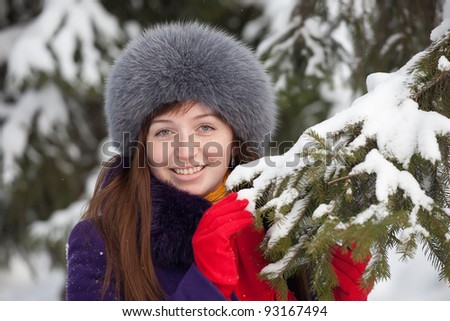 Young woman  wearing winter coat and fur cap
