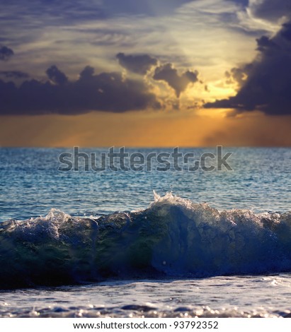 Sea wave during storm in sunset time