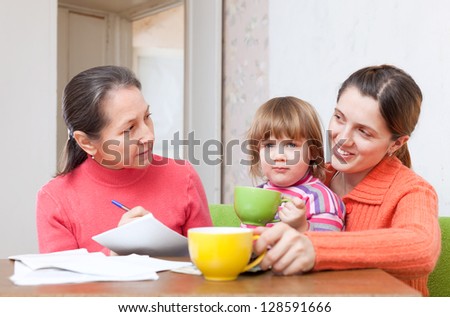 Family of three  generation calculates the budget at  home