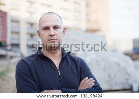 Portrait of builder at construction site