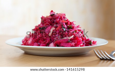 Vegetable salad with beets and cabbage  in white plate