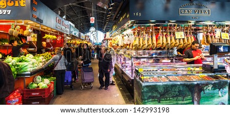 BARCELONA, SPAIN - MARCH 28: Interior of  Boqueria market in March 28, 2013 in Barcelona, Spain.  Market has been known since 1217. Now - one of the city\'s foremost tourist landmarks