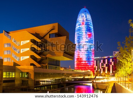 Barcelona, Spain - April 12: Night View Of Torre Agbar In April 12, 2013 In Barcelona, Spain. 38 Storey Skyscraper, Built In 2005 By Nouvel. Now One Of Symbols Of Barcelona Is Owned By Grupo Agbar
