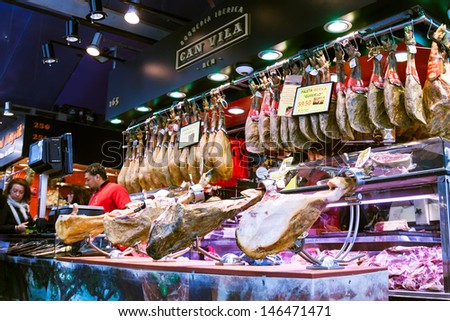 BARCELONA, SPAIN - MARCH 28: gammon at La Boqueria market in March 28, 2013 in Barcelona, Spain.  Market has been known since 1217. Now - one of the city\'s foremost tourist landmarks