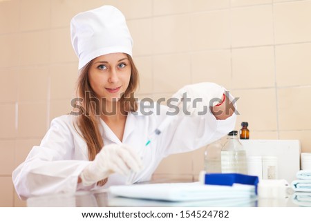 Positive nurse ready to make an injection
