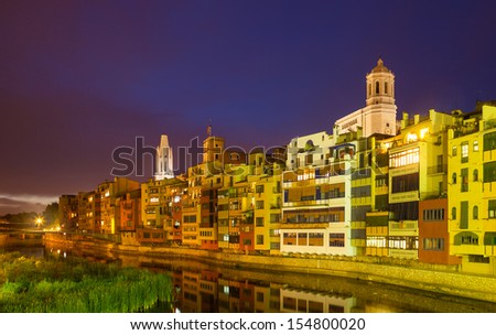 Evening view of of Girona - picturesque houses on the river bank. Catalonia, Spain