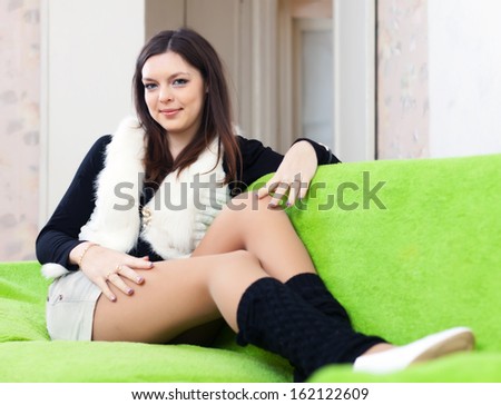 Portrait of  woman in leg warmers at home interior