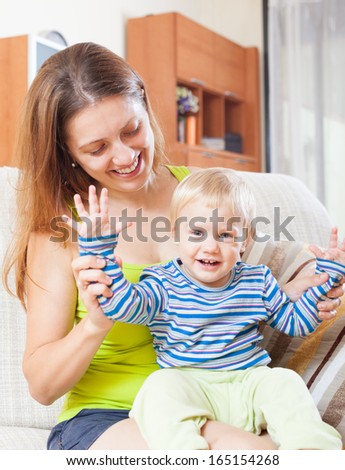 portrait of happy mom with toddler