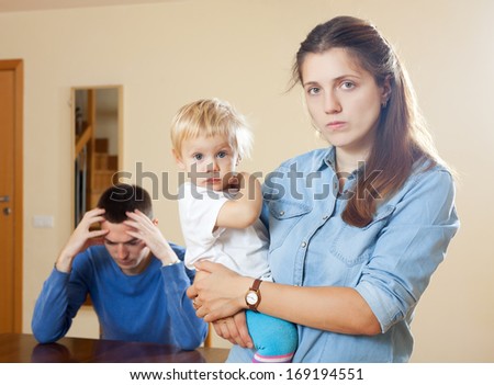 Family of three with child having conflict