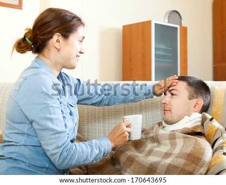 Adult woman caring for sick man