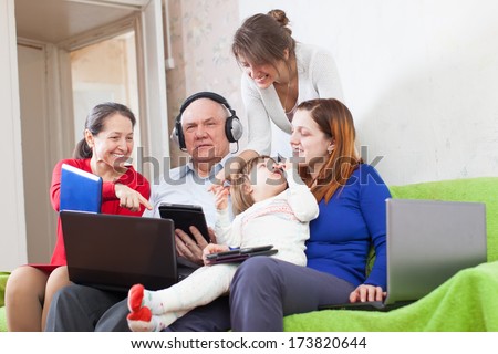 family together with few electronic communication devices at home