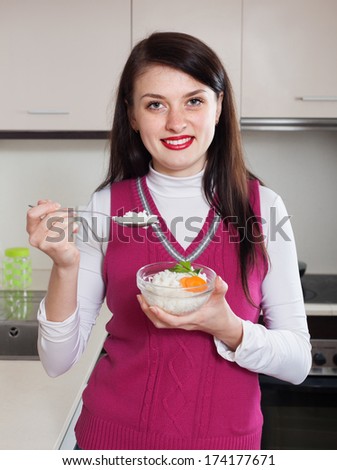 Woman eating  rice in home
