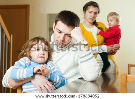 Family with two children having quarrel at home