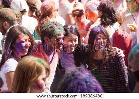 BARCELONA, SPAIN - APRIL 6, 2014: People at Festival of colors Holi Barcelona. Holi is  holiday of Indian Culture