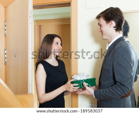Girl came to man with gift at home