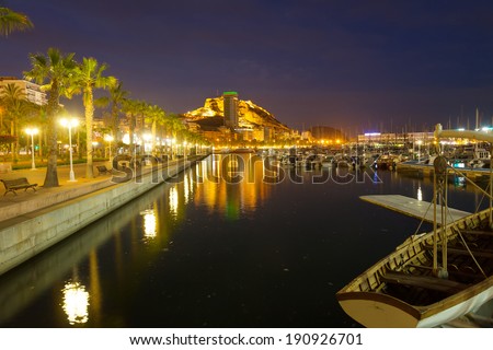 View of Port with yachts and embankment in night. Alicante, Spain