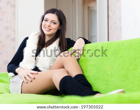 woman in leg warmers at home interior