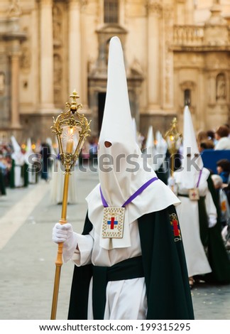 MURCIA, SPAIN - APRIL 15, 2014: Holy Week in Spain. Holy Week is  annual commemoration by Christian religious brotherhoods, processions on  streets
