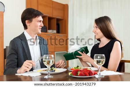 Surprise girl in love to the man at dinner