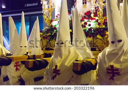 MURCIA, SPAIN - APRIL 15, 2014: Evening procession during Holy Week in Murcia. Semana Santa or Holy Week is Christian religious processions on  streets of Spanish cities and town