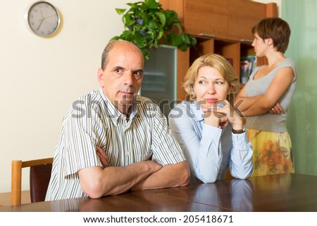 Mature parents with   daughter having conflict  in home interior