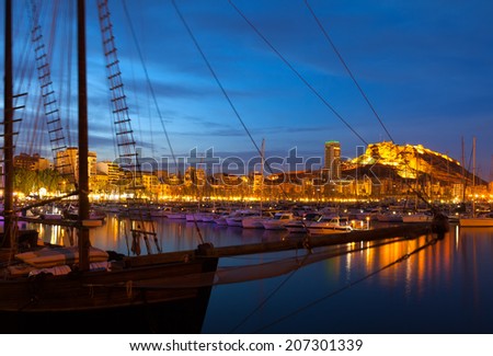 yachts against Castle of Santa Barbara in night. Alicante, Spain