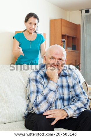 Family quarrel. Upset man against angry woman