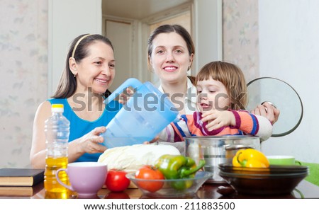 Happy family together cook  in the kitchen at home