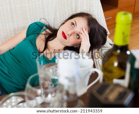 Woman having hangover after celebrating of holiday