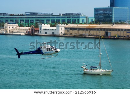 BARCELONA, SPAIN - AUGUST 1, 2014: Flying helicopters of Helicopters tours company. Barcelona, Spain