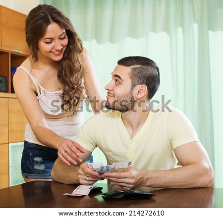 Pretty girl asking for money from  husband for the purchase