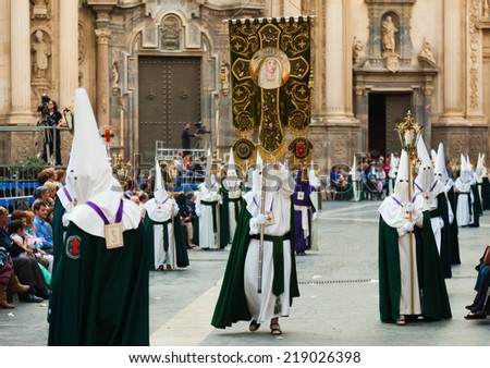 MURCIA, SPAIN - APRIL 15, 2014: Holy Week in Spain. Holy Week is  annual commemoration by Christian religious brotherhoods, processions on  streets of Spanish city and town