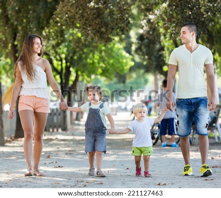 Happy family with children holding vacation day outdoor
