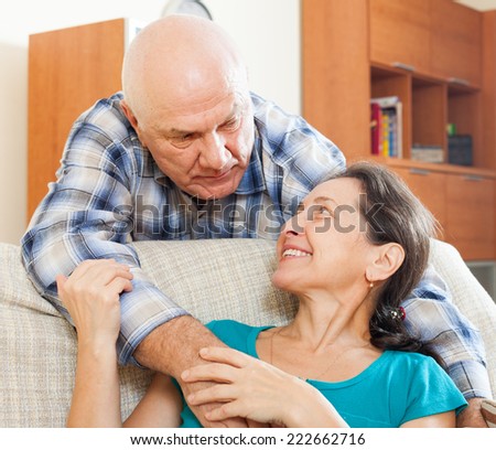 mature man with beloved wife in home