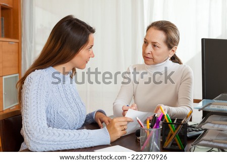 Female employee interviewing young woman at office