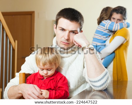 Young family with children having quarrel at home