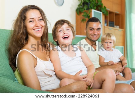 Happy  man with young wife and  two children