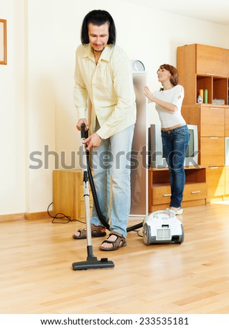 middle-aged couple are doing house cleaning