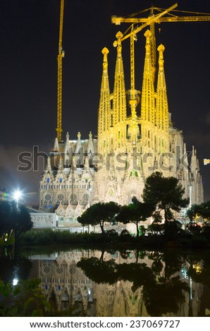 BARCELONA, SPAIN - SEPTEMBER 13, 2014: Sagrada Familia in night. Barcelona, Catalonia.  Famous Church building is begun in 1882 and completion is planned in 2030