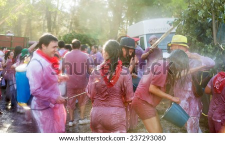 HARO, SPAIN - JUNE 29, 2014:  Batalla del vino - wine madness in Haro, Spain. People fighting with wine